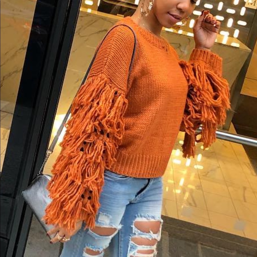 Orange fringe sweater